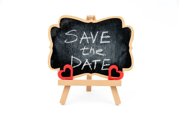 Wooden easel mini blackboard, text SAVE THE DATE — Stock Photo, Image