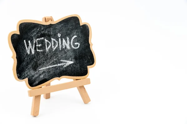 Wooden easel mini board with text WEDDING — стоковое фото