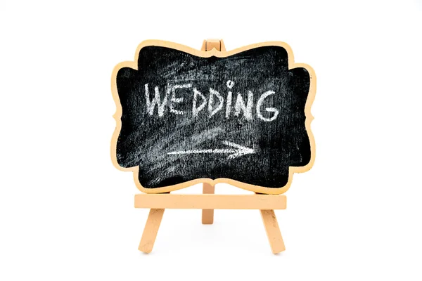 Wooden easel mini board with text WEDDING — стоковое фото