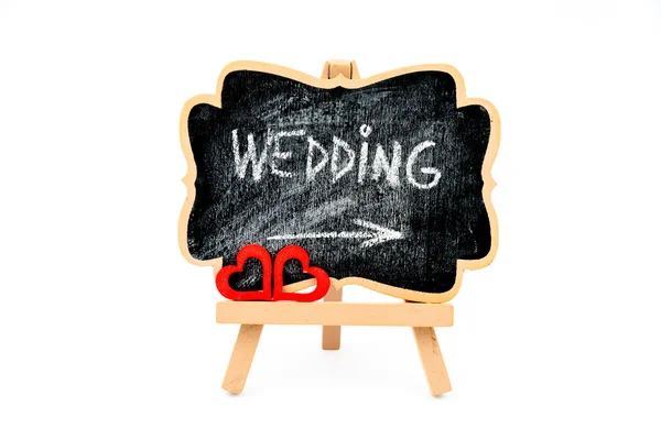 Wooden easel mini board, text WEDDING — стоковое фото