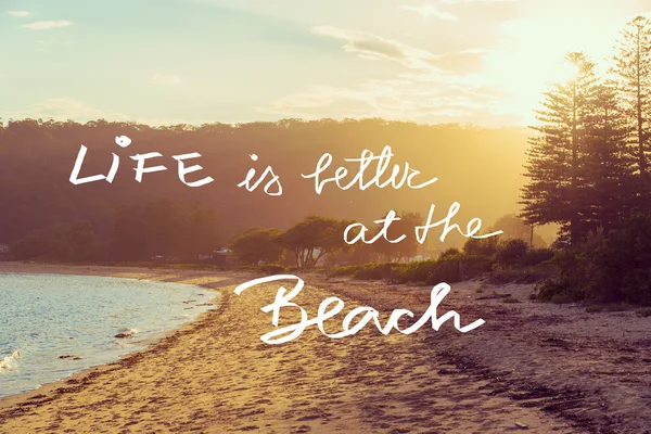 Handwritten text over sunset beach background — Stock Photo, Image