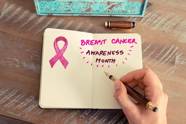 Pink ribbon as breast cancer awareness month sign — Stock Photo, Image