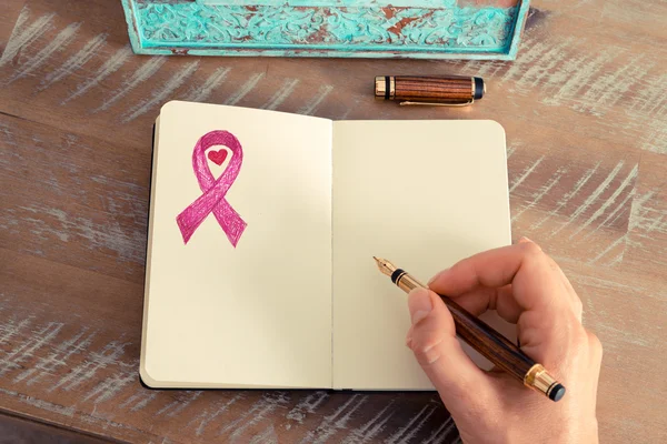 Pink ribbon as breast cancer awareness symbol — Stock Photo, Image