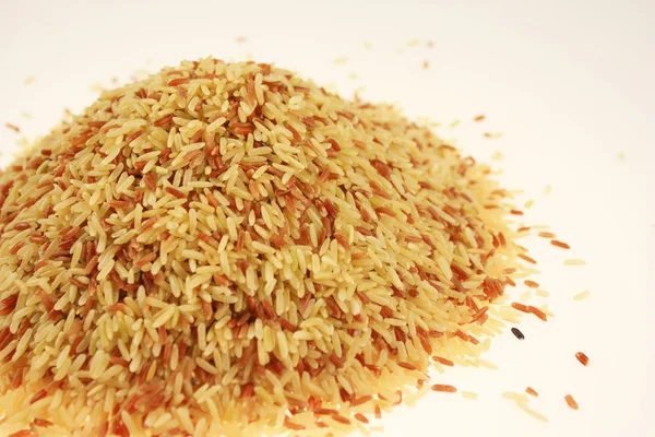 Grãos de arroz marrom fundo — Fotografia de Stock