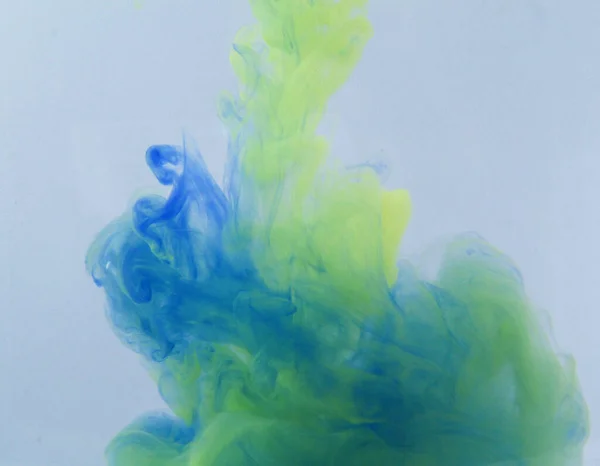 Motion Color drop in water,Ink swirling in ,Colorful ink abstraction.Fancy Dream Cloud of ink under water.Acrylic colors and ink in water. Abstract background