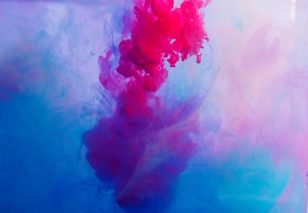 Motion Color drop in water,Ink swirling in ,Colorful ink abstraction.Fancy Dream Cloud of ink under water.Acrylic colors and ink in water. Abstract background
