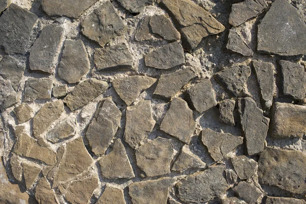 Textura de pedra wall.photo de uma parede de pedra em um dia ensolarado — Fotografia de Stock