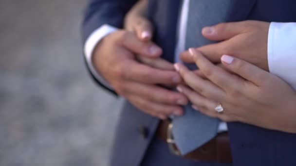 Hands hugging the bride and groom close-up — Stockvideo
