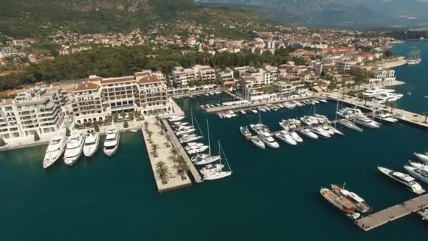 View of the Porto Montenegro marina in Tivat, yachts at the pier and hotel complex — Stock Video