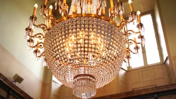 Antique large crystal chandelier with pendants and candles. — Stock Video