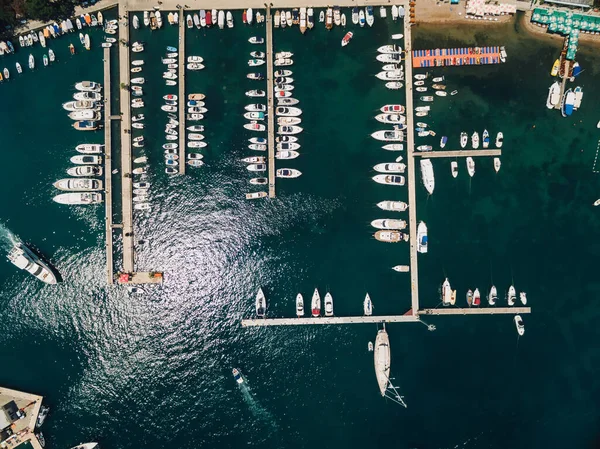 Many yachts dock on the pier near the city of Budva Montenegro. View from above — Stock Photo, Image