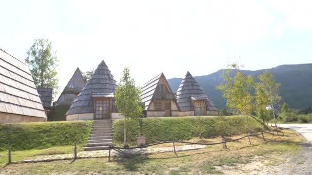 Triangular and conical houses at the foot of the mountains in Durmitor National Park — Stock Video