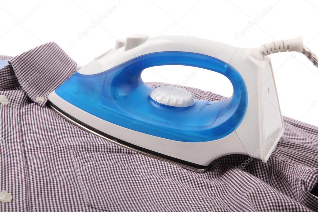 Ironing a shirt with a steam iron