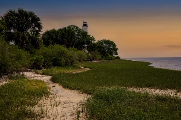 Sun setting over the lighthouse at St Marks National Park in Northern Florida