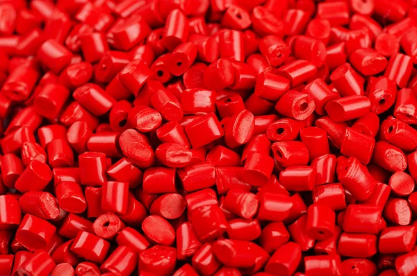 Red plastic grains — Stock Photo, Image