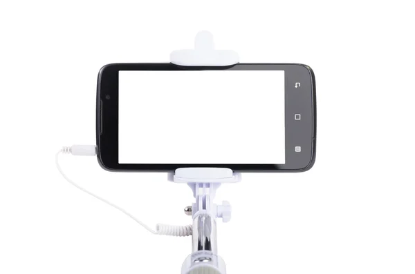 Smart phone on a selfie stick — Stock Photo, Image