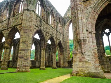 Ruins of Tintern Abbey, a former church in Wales clipart