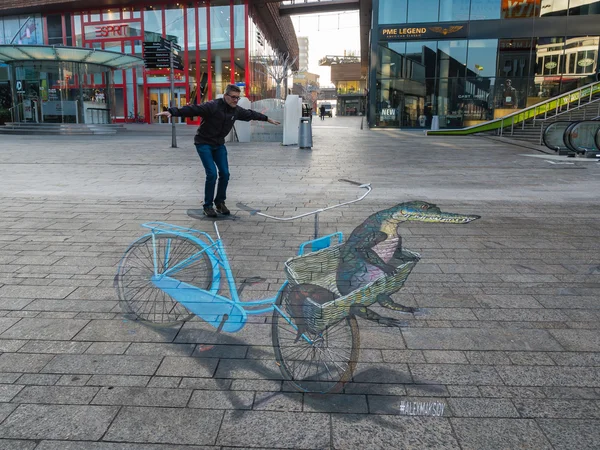 Straatkunst weergegeven: optische illusie Stockfoto