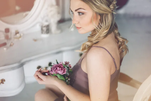 Bride morning. Woman with flowers. Wedding day