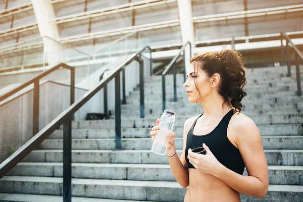 Sport woman. Rest.Drink water. Water bottle .Motivation. Sport concept