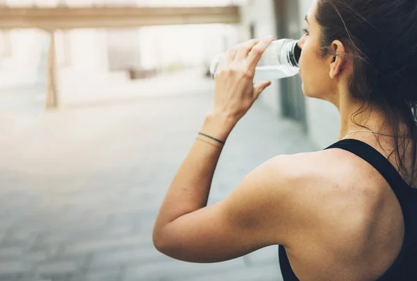 Sport woman. Rest.Drink water. Water bottle .Motivation. Sport concept