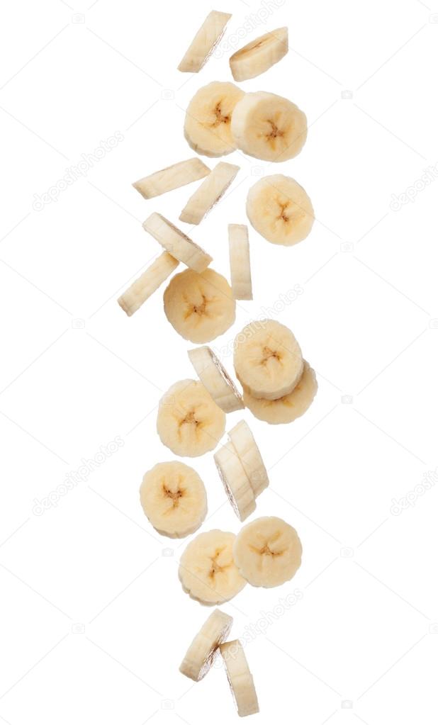 Falling banana slices isolated on white background