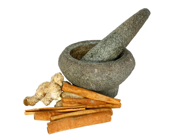 Ginger and cinnamon with stone pounder isolated on white — Stock Photo, Image