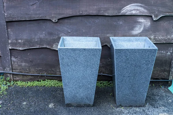 Close View Two Granite Plant Pots Sitting New Wooden Fence — Stock Photo, Image