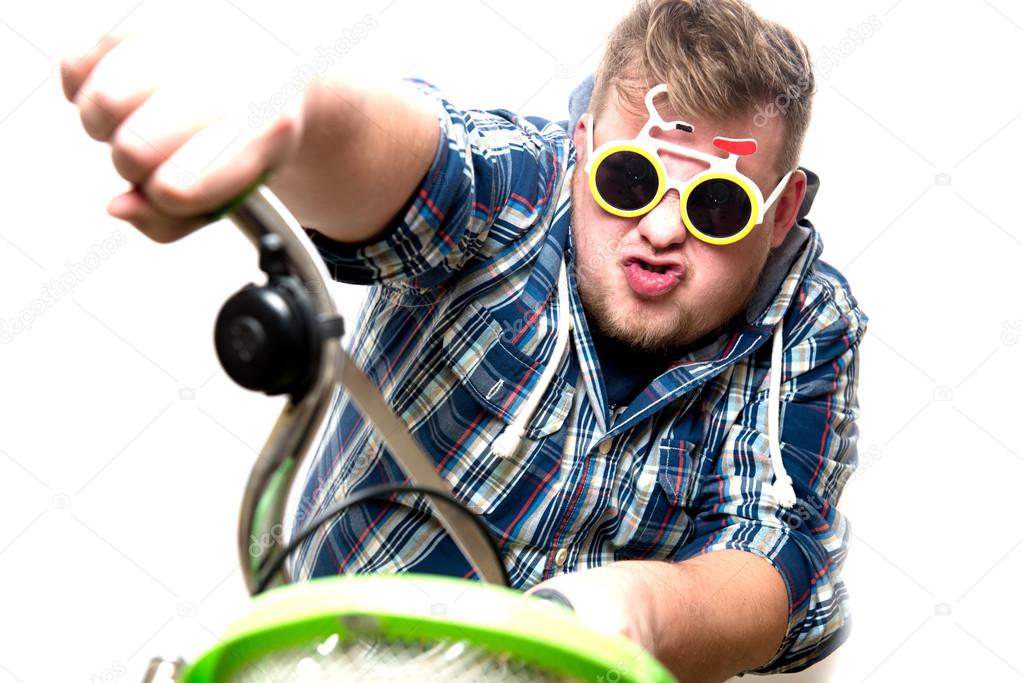 guy with glasses in a bike
