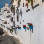 Beautiful street with flowers in the Mijas town, Spain — Stock Photo ...
