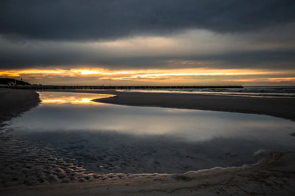 Sunset on the beach in Leba, Baltic Sea, Poland — Stock Photo, Image