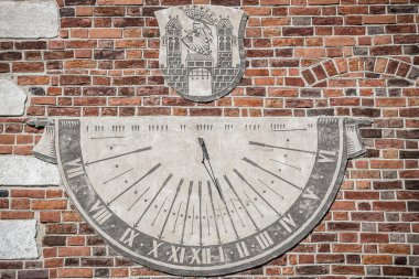 Sandomierz, town in Poland. Old town hall sundial. clipart