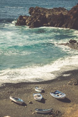 Atlantic Ocean on the island of Lanzarote. A wonderful rocky bea clipart