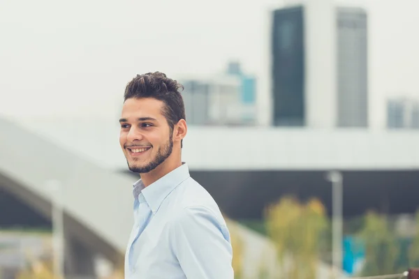 Young handsome man posing in an urban context — Stock Photo, Image