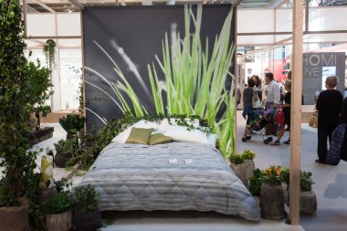 Double bed on display at HOMI, home international show in Milan, Italy clipart