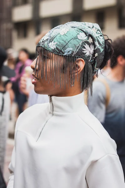 Man posing outside Gucci fashion shows building for Milan Women's Fashion Week 2014