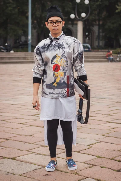 Man outside Cavalli fashion shows building for Milan Women's Fashion Week 2014