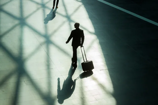 Silhouettes and shadows of businessman walking — Stock Photo, Image