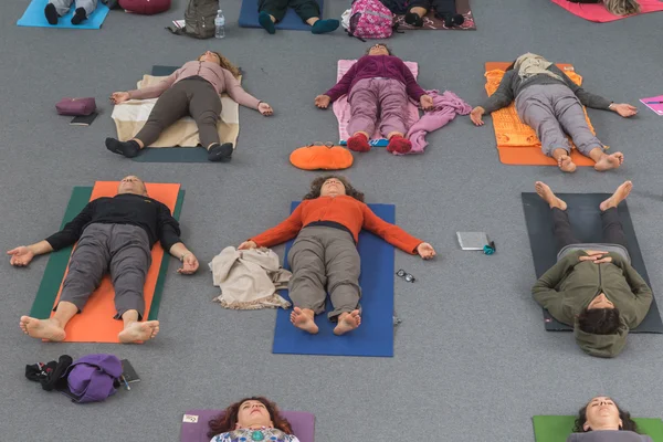 People take a class at Yoga Festival 2014 in Milan, Italy