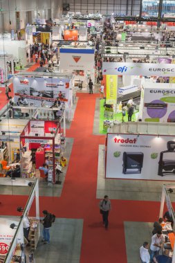 Top view of people and booths at Viscom trade fair in Milan, Italy clipart