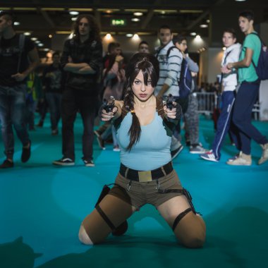 Lara Croft cosplayer posing at Games Week 2014 in Milan, Italy clipart
