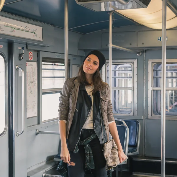 Pretty girl posing in a metro car — Stock Photo, Image