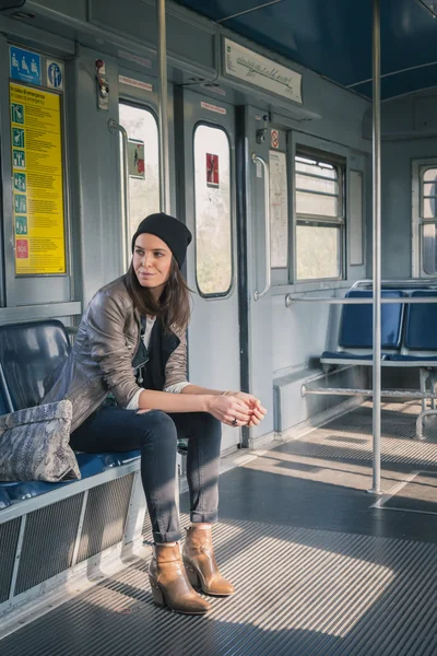 Pretty girl posing in a metro car — Stock Photo, Image