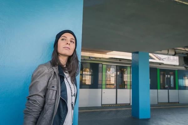 Pretty girl posing in a metro station — Stock Photo, Image