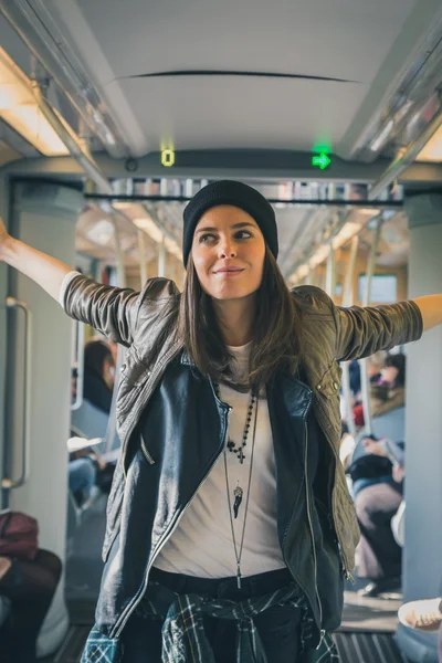 Pretty girl posing in a metro car — Stock Photo, Image