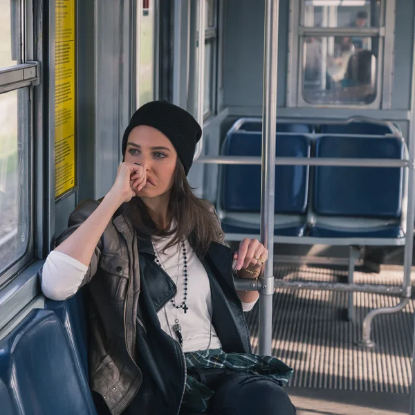 Pretty girl posing in a metro car — Stock Photo, Image