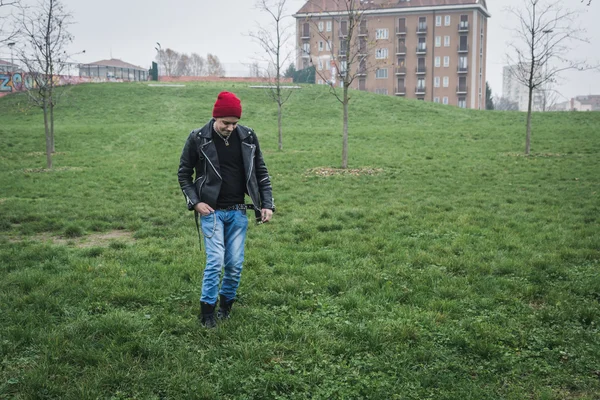 Punk guy posing in a city park — Stock Photo, Image