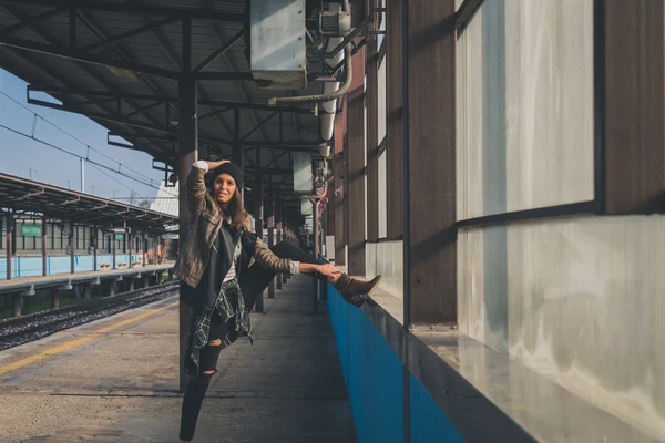 Pretty girl posing in a metro station — Stock Photo, Image