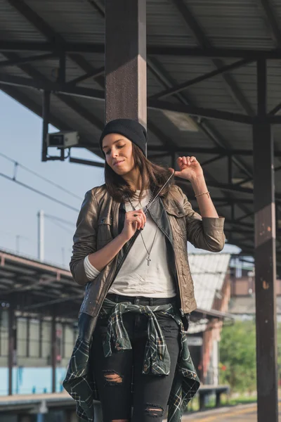 Pretty girl posing in a metro station — Stock Photo, Image