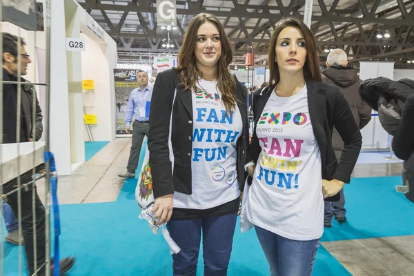 Girls wearing Expo t-shirt at Bit 2015, international tourism exchange in Milan, Italy — Stock Photo, Image
